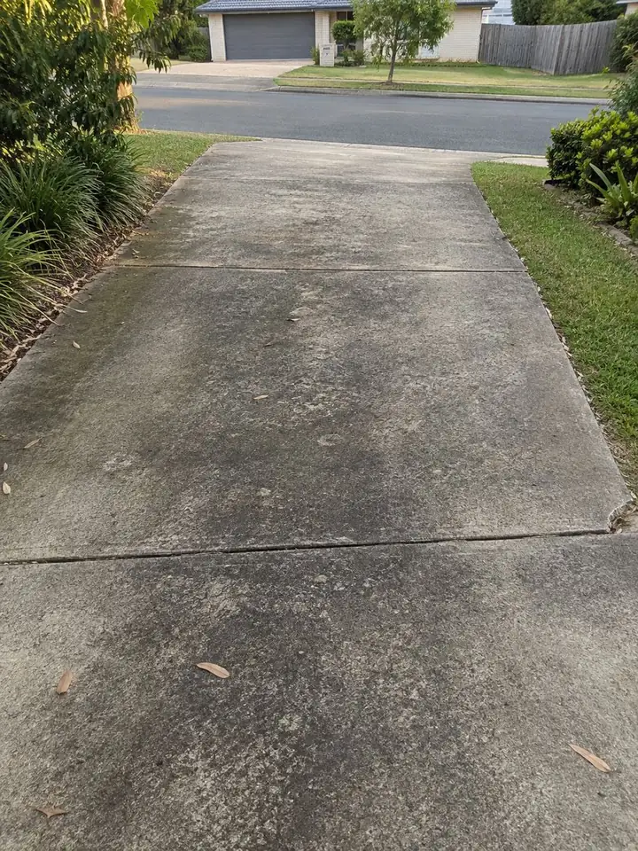 Concrete driveway in brisbane before pressure cleaning
