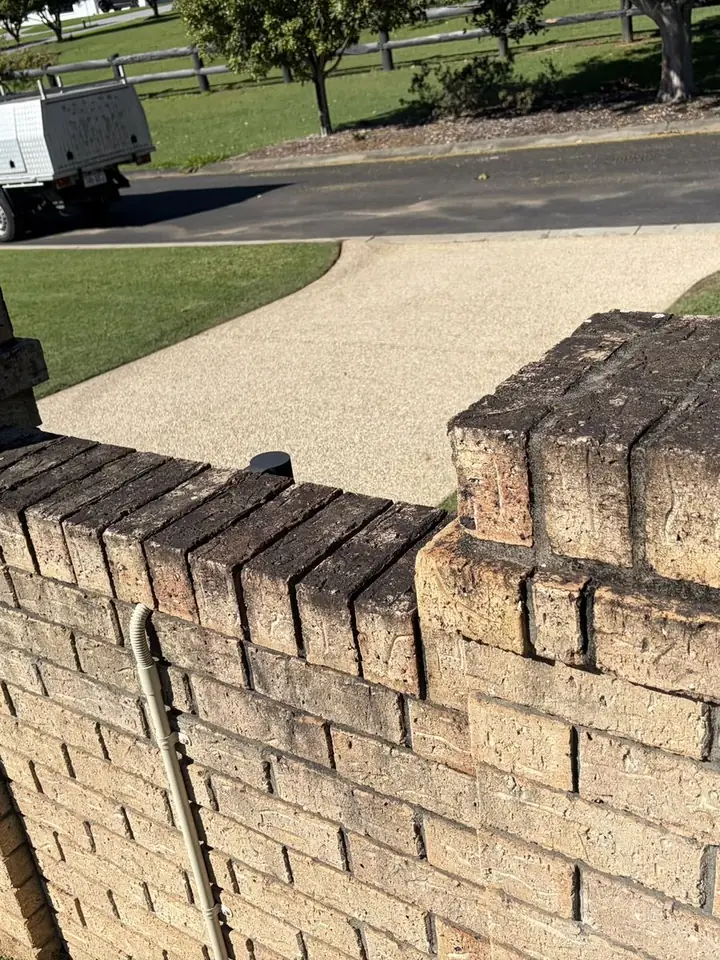 Brick front fence and pillars in brisbane before cleaning